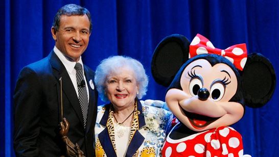 Betty White smiling at a Disney DVC event, celebrating her legacy.