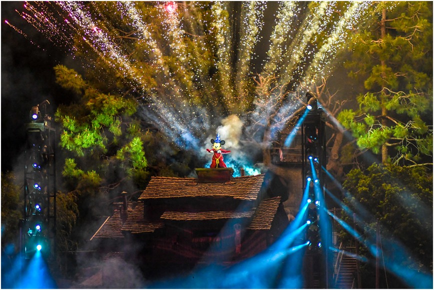 Colorful fireworks illuminating the night sky at Disney's Fantasmic show at a DVC resort.