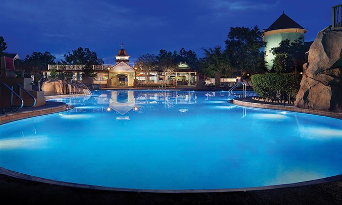 Saratoga Springs Resort pool area at Disney Vacation Club, showcasing lush landscaping.