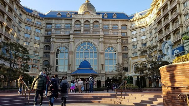 Disney Vacation Club resort pool area with guests enjoying their stay.