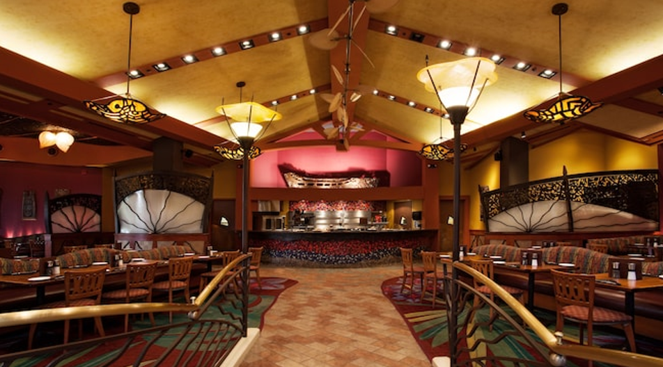 Luxurious Polynesian Villas at Disney Vacation Club resort with tropical landscaping.