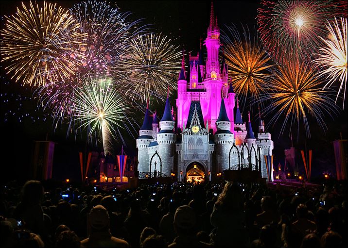 Spectacular Disney nighttime fireworks illuminating the sky above a DVC resort.