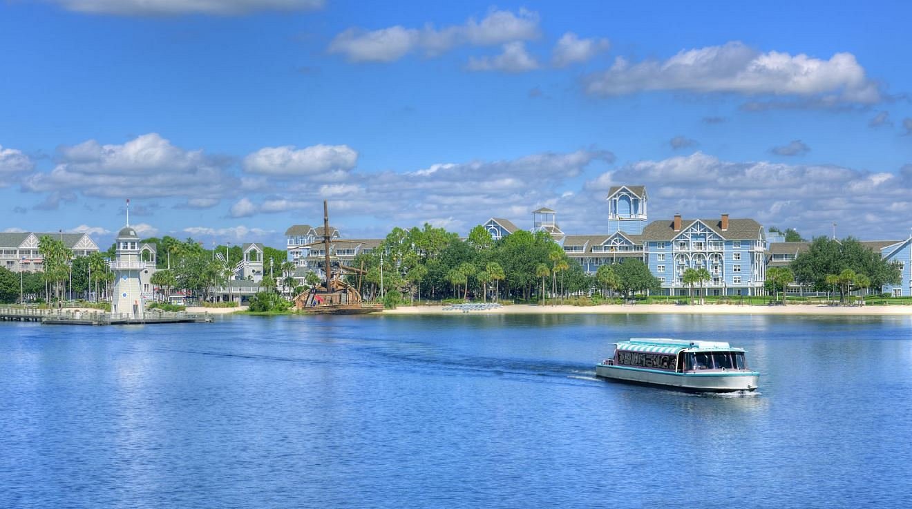 Disney Vacation Club members enjoying a resort pool at Disney's Riviera Resort.