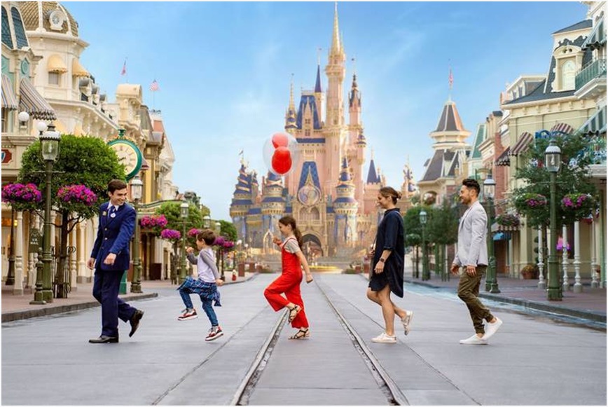 Crowded Disneyland entrance with excited families, perfect for DVC visitors.